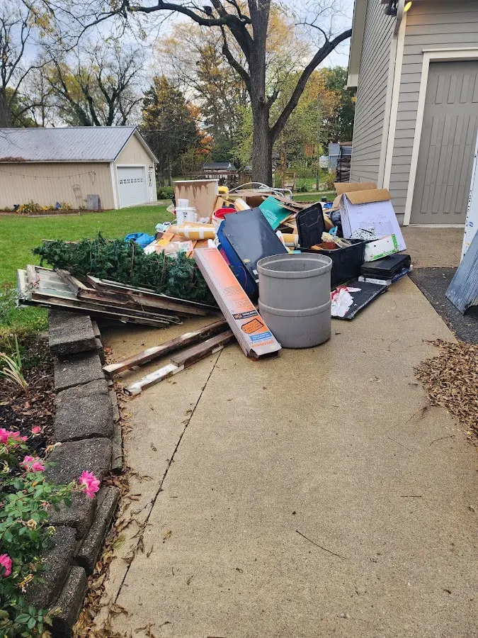 Dumpster being loaded with debris for 30 Yard Dumpster Rental in Groton
